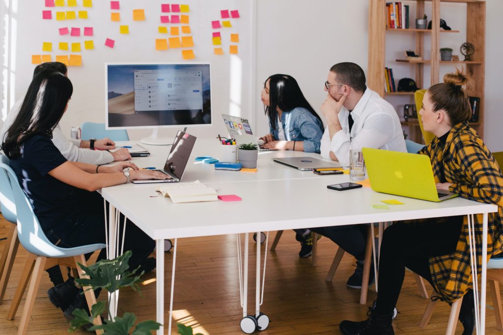 image of designers picking a jewelry business name in a conference room